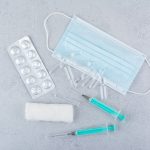 mask ampoules syringes medical pills marble background high quality photo